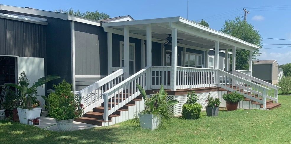 Painted deck and porch railing on a Skystone Homes LLC project