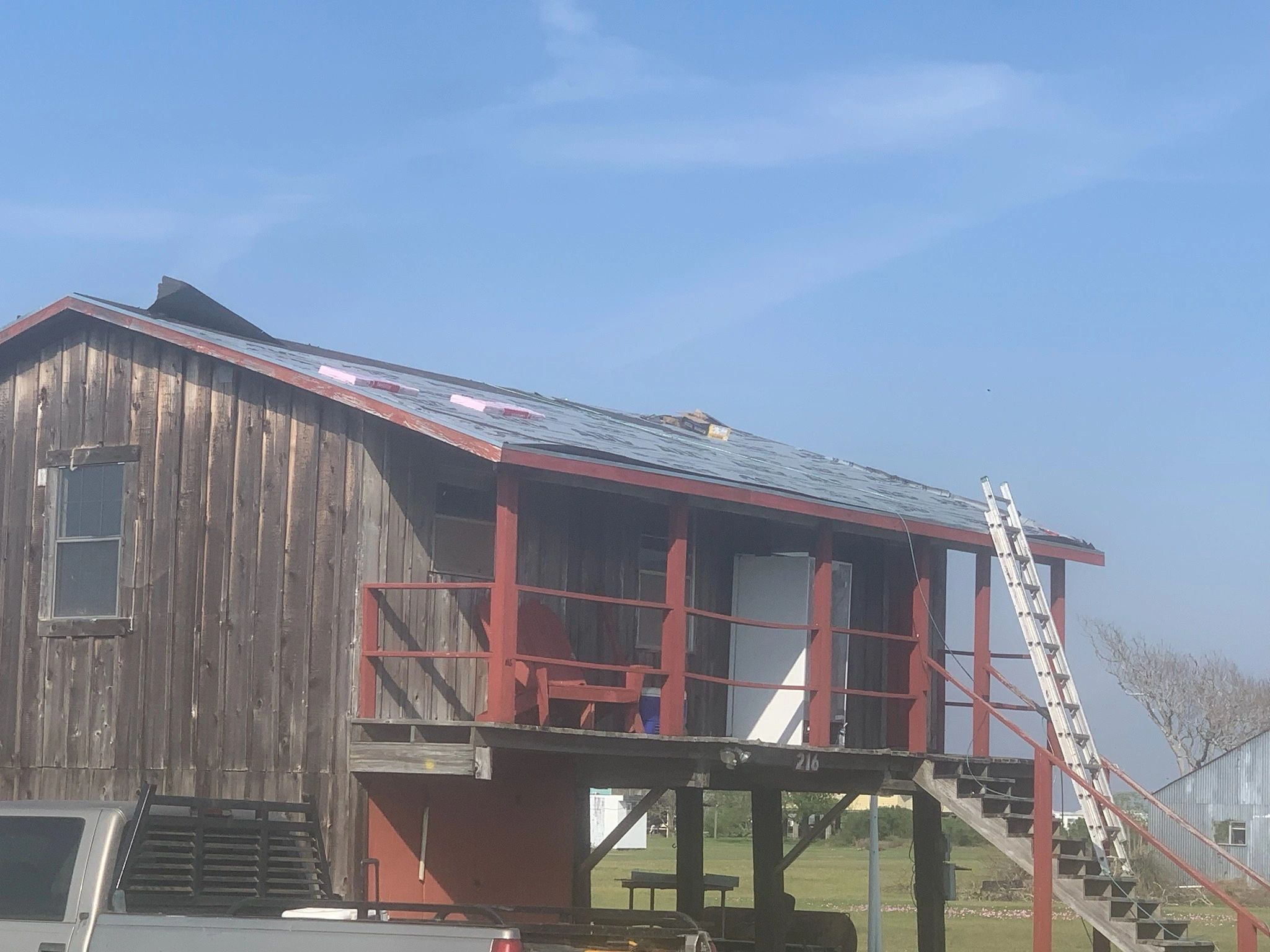 Re-roof and pilings project — original exterior — Skystone Homes LLC project